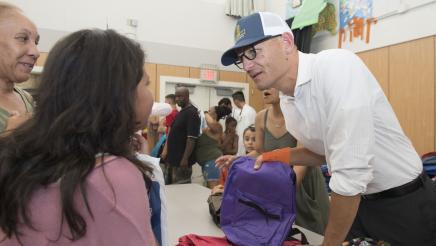 Assemblymember McCarty passes out backpacks
