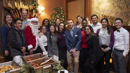 Assemblymember Kevin McCarty, Staff, and attendees with Santa